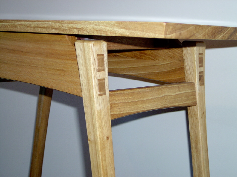 Clark's furniture features exquisite designs, joinery, and exotic woods. This asian-inspired stool features honduras mahagony, cocobolo pins, and through mortise and tenon joinery.